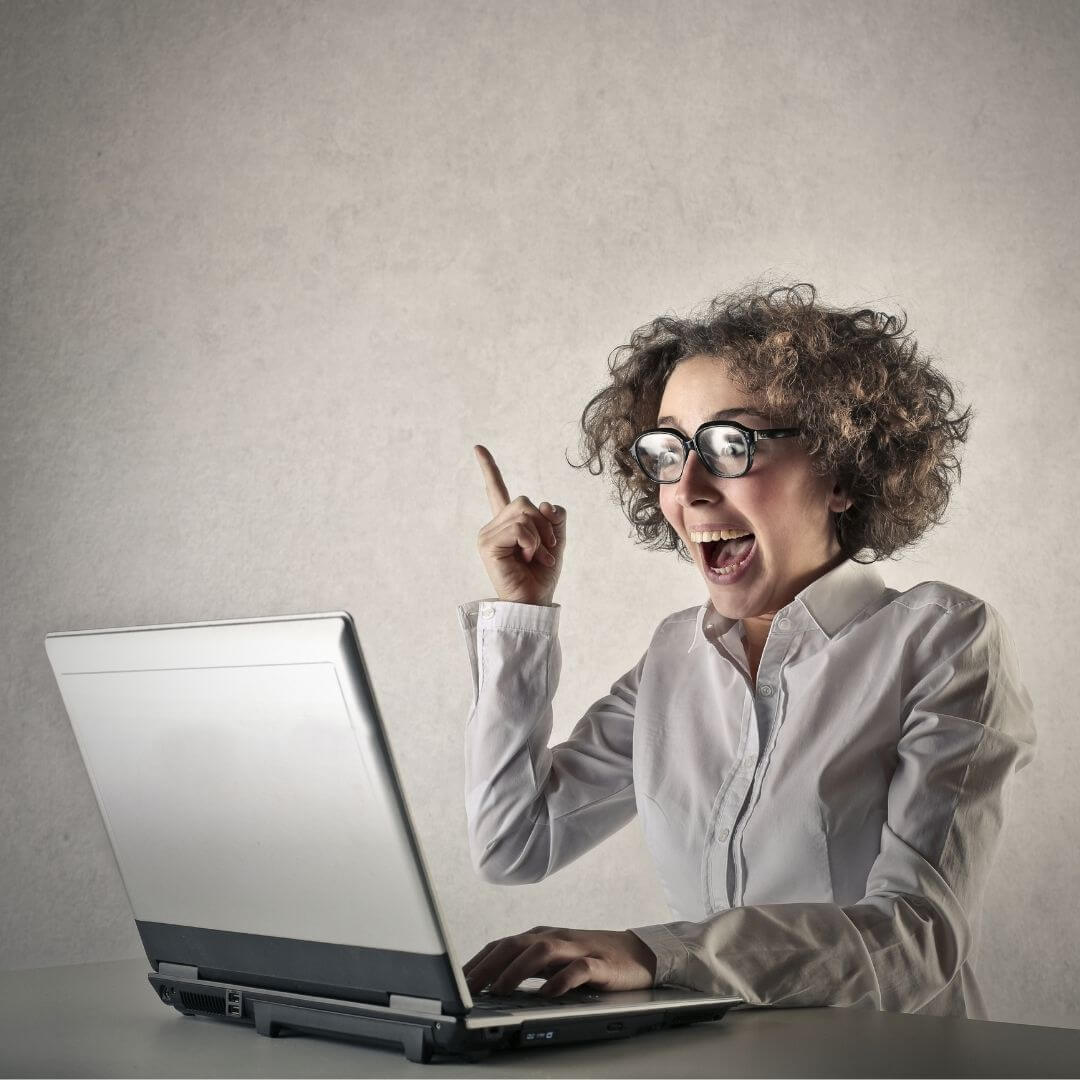 happy woman at laptop